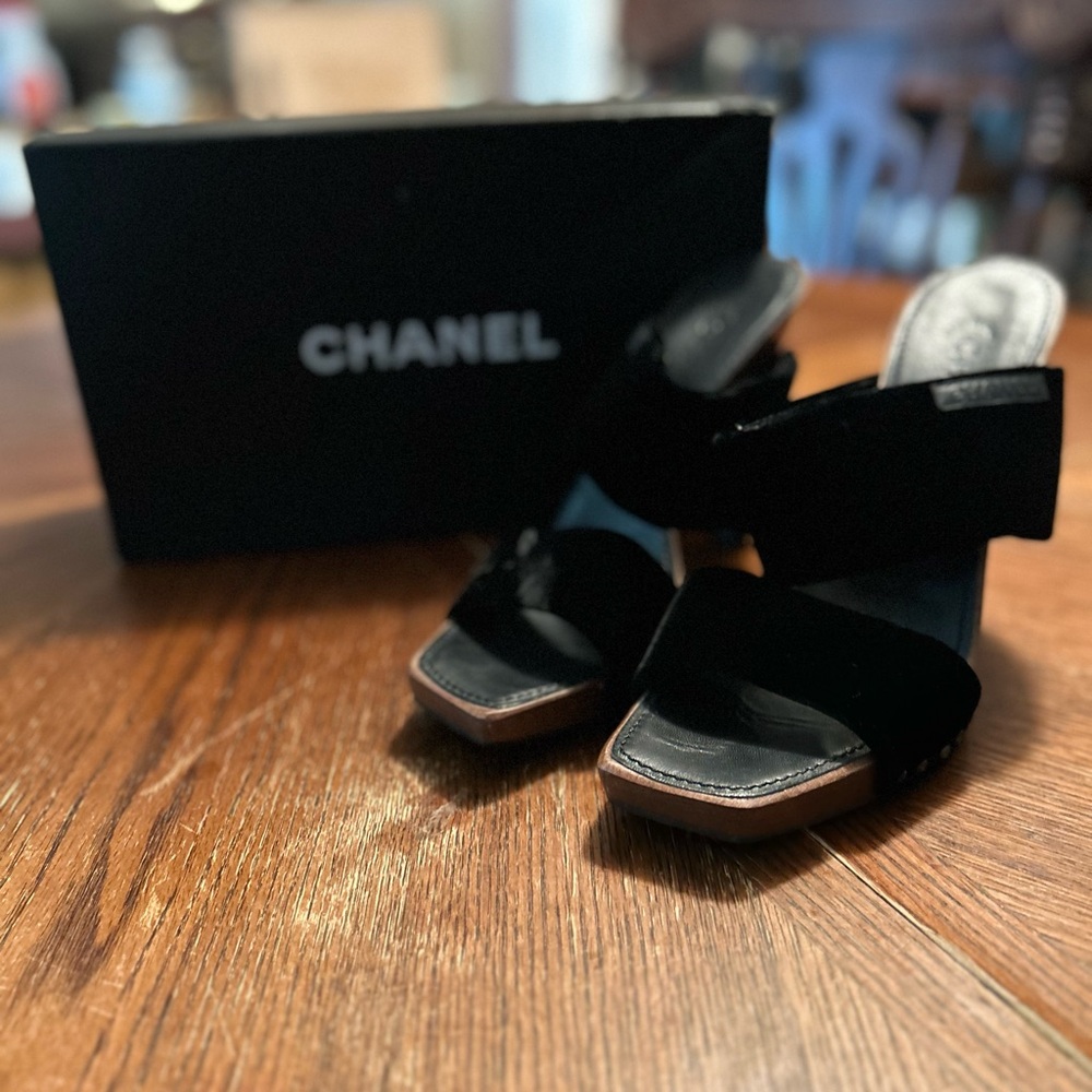 Pair of Chanel black swayed mule open toed shoes.Size 41 converts to size 8 US